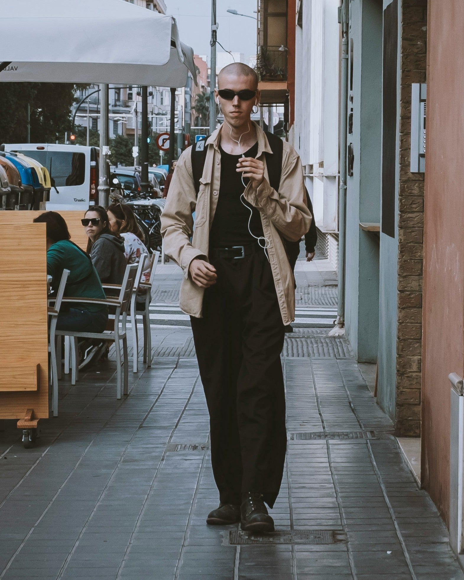 Stylish American man wearing modern luxury menswear from TAHMINA, in an urban streetwear-inspired setting