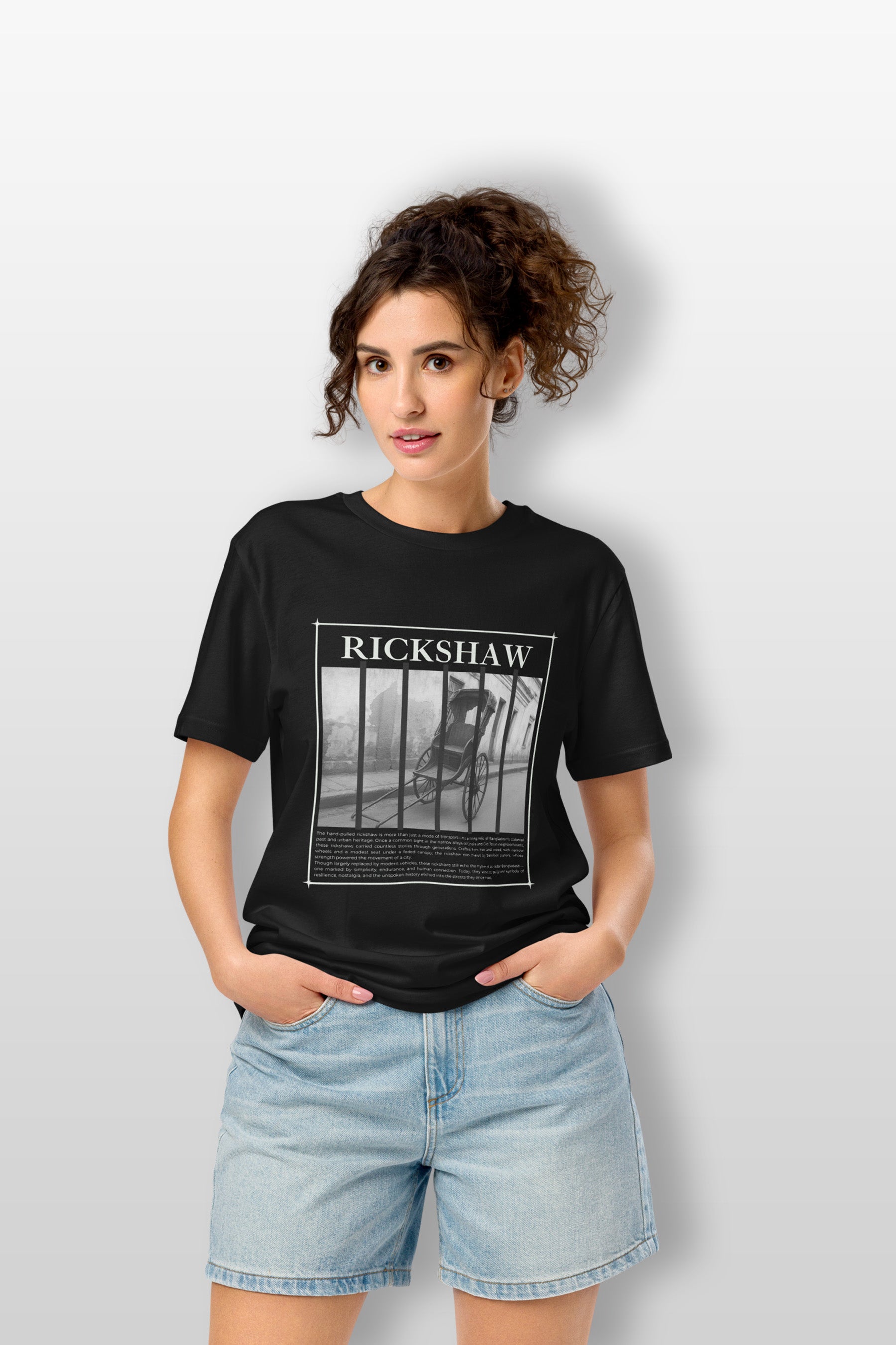 Black unisex t-shirt with a monochrome "Rickshaw" graphic design featuring a traditional Bangladeshi rickshaw behind vertical bars, symbolizing cultural heritage.