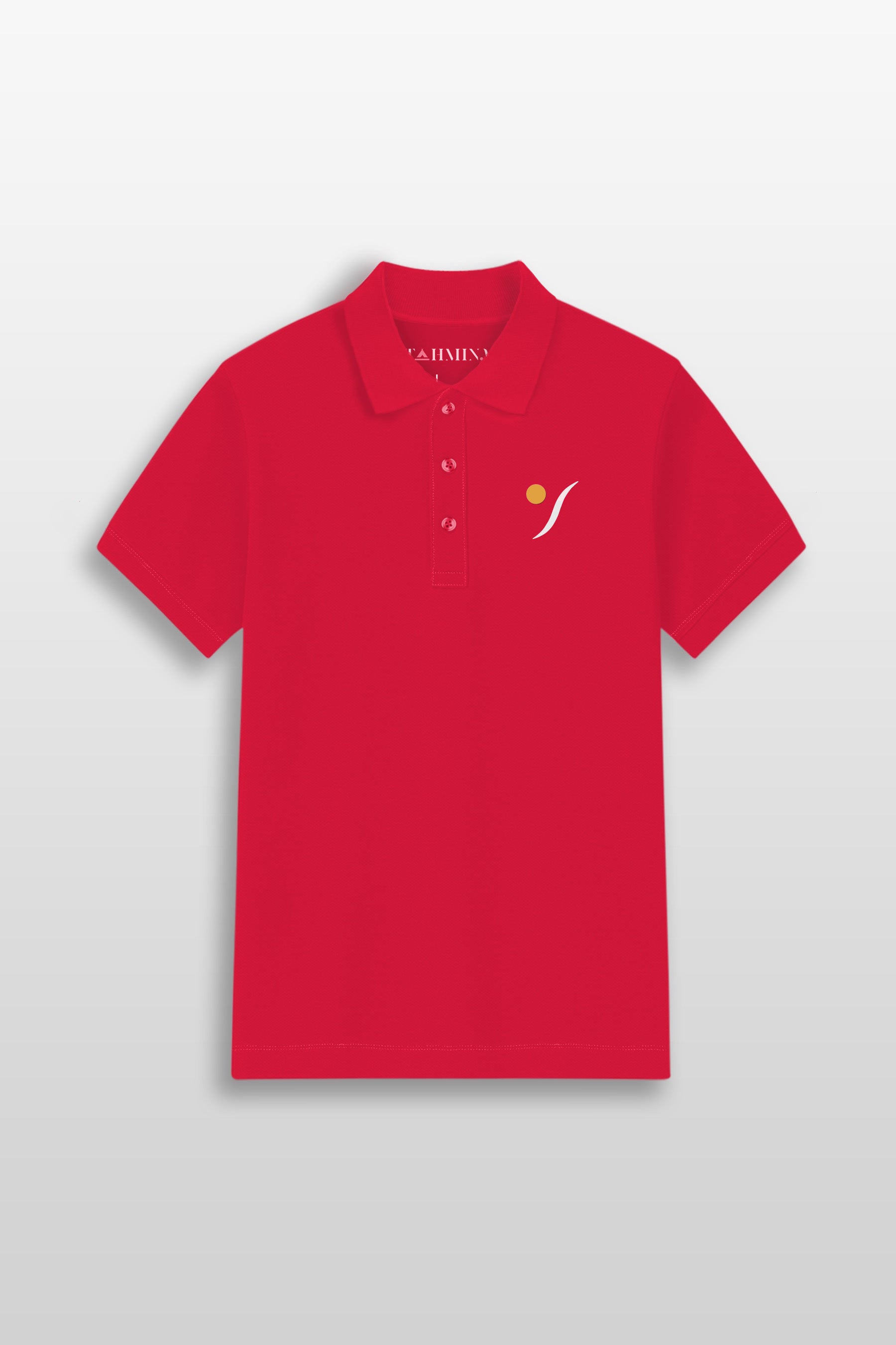 Red TAHMINA premium piqué polo shirt displayed on a wooden hanger with branded label, set against a luxurious marble background. The shirt features a minimal chest logo, a classic ribbed collar, and a tone-on-tone button placket.